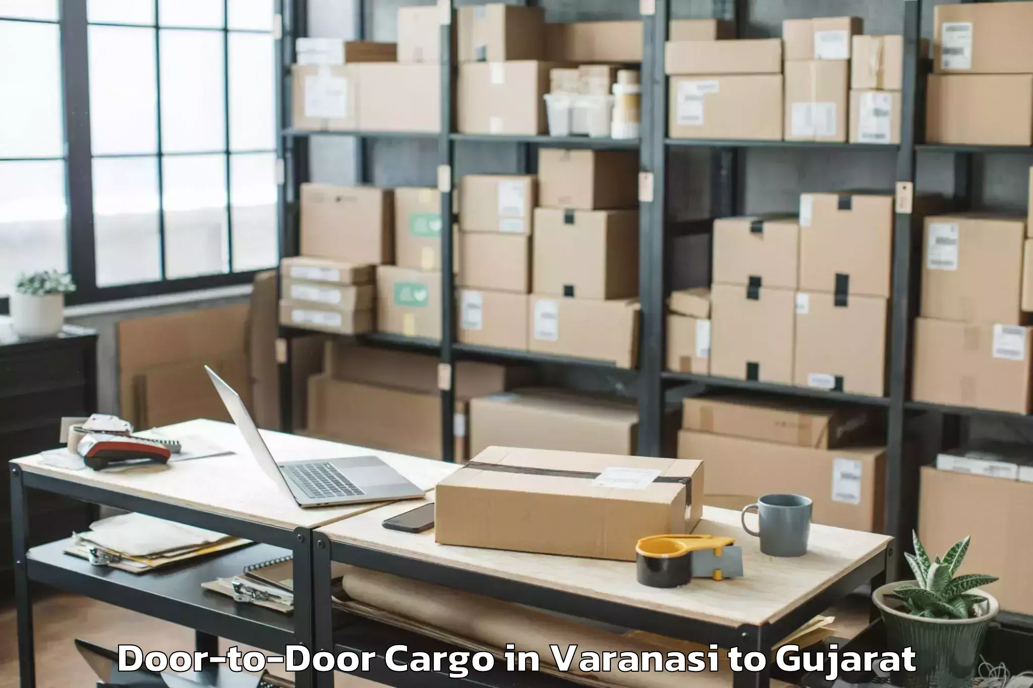 Professional Varanasi to Dhoraji Door To Door Cargo